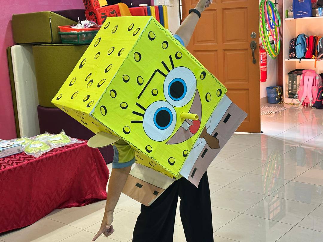 A SpongeBob character joining a birthday celebration at Dloving