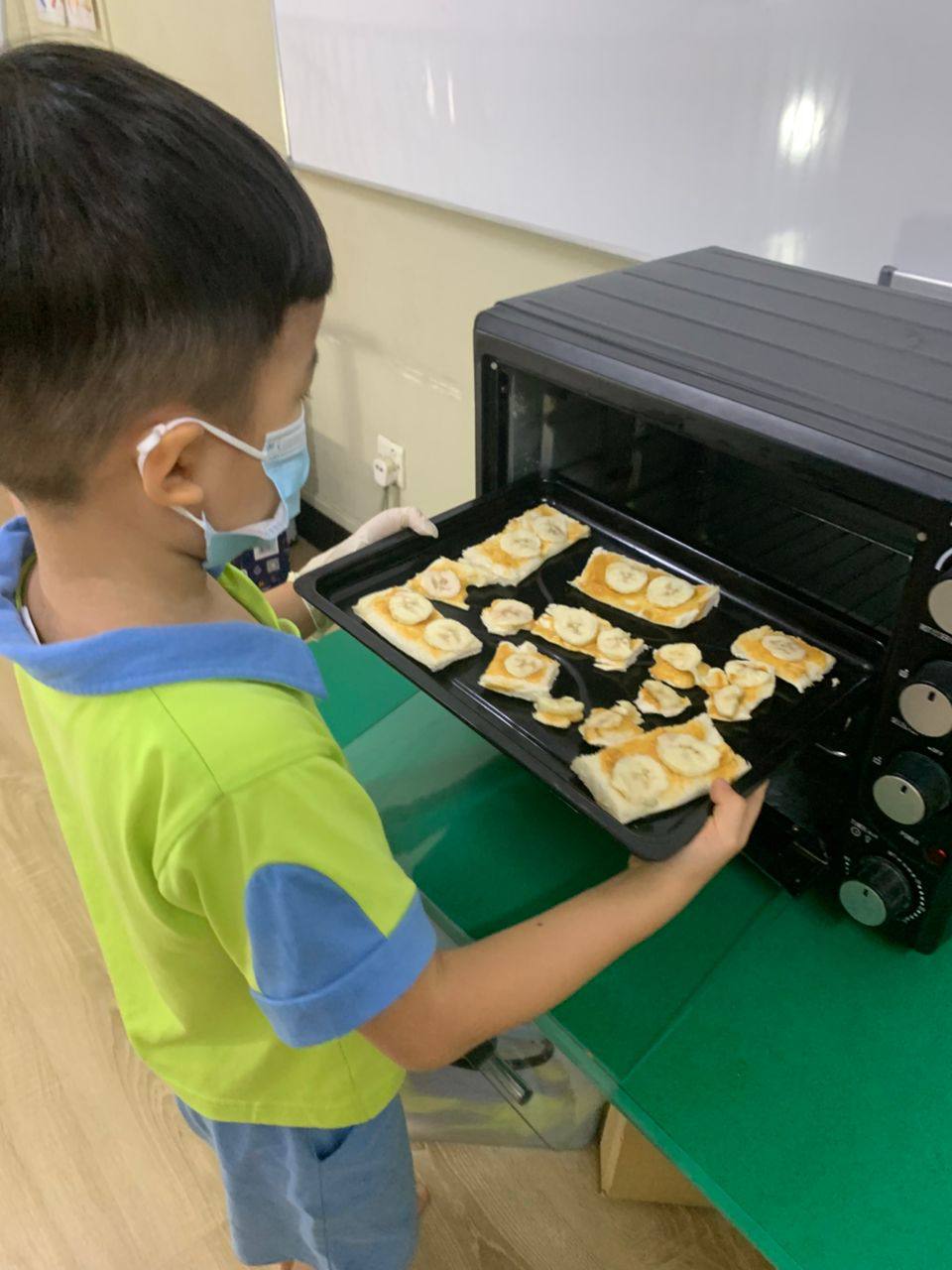 Dloving children preparing their own breakfast during a supervised activity