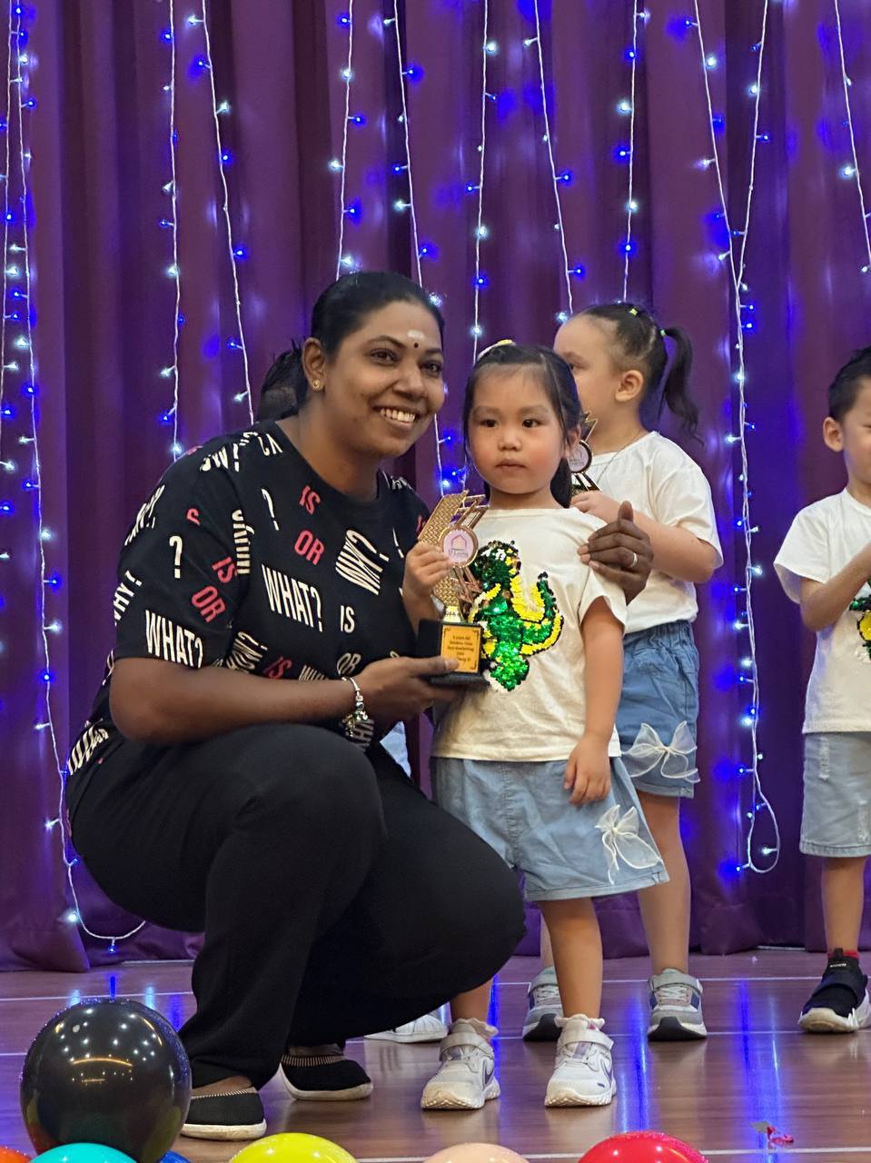 Munis celebrating with a child