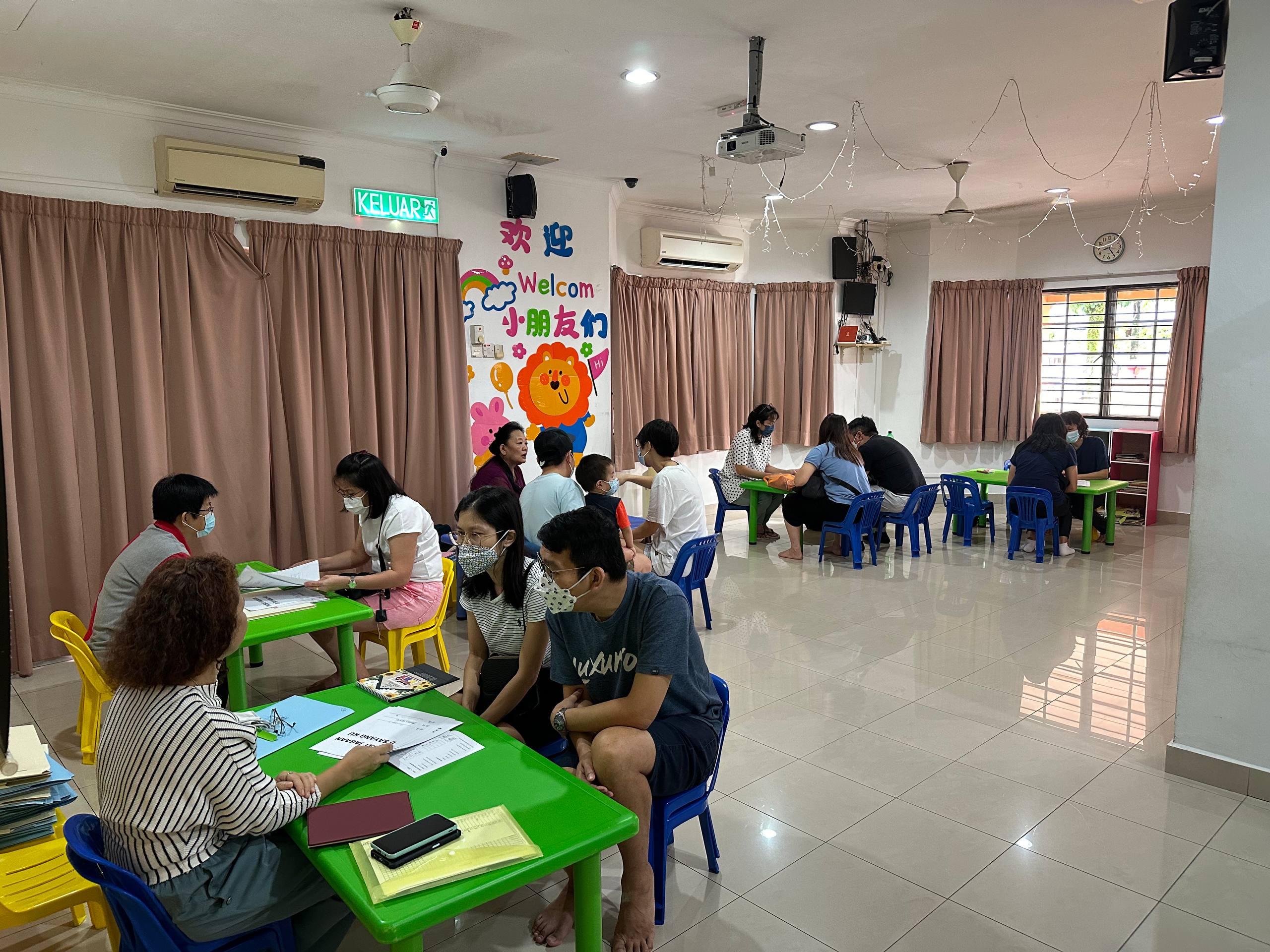 A Dloving parent and Care and Learning Team member meeting to discuss a child’s progress
