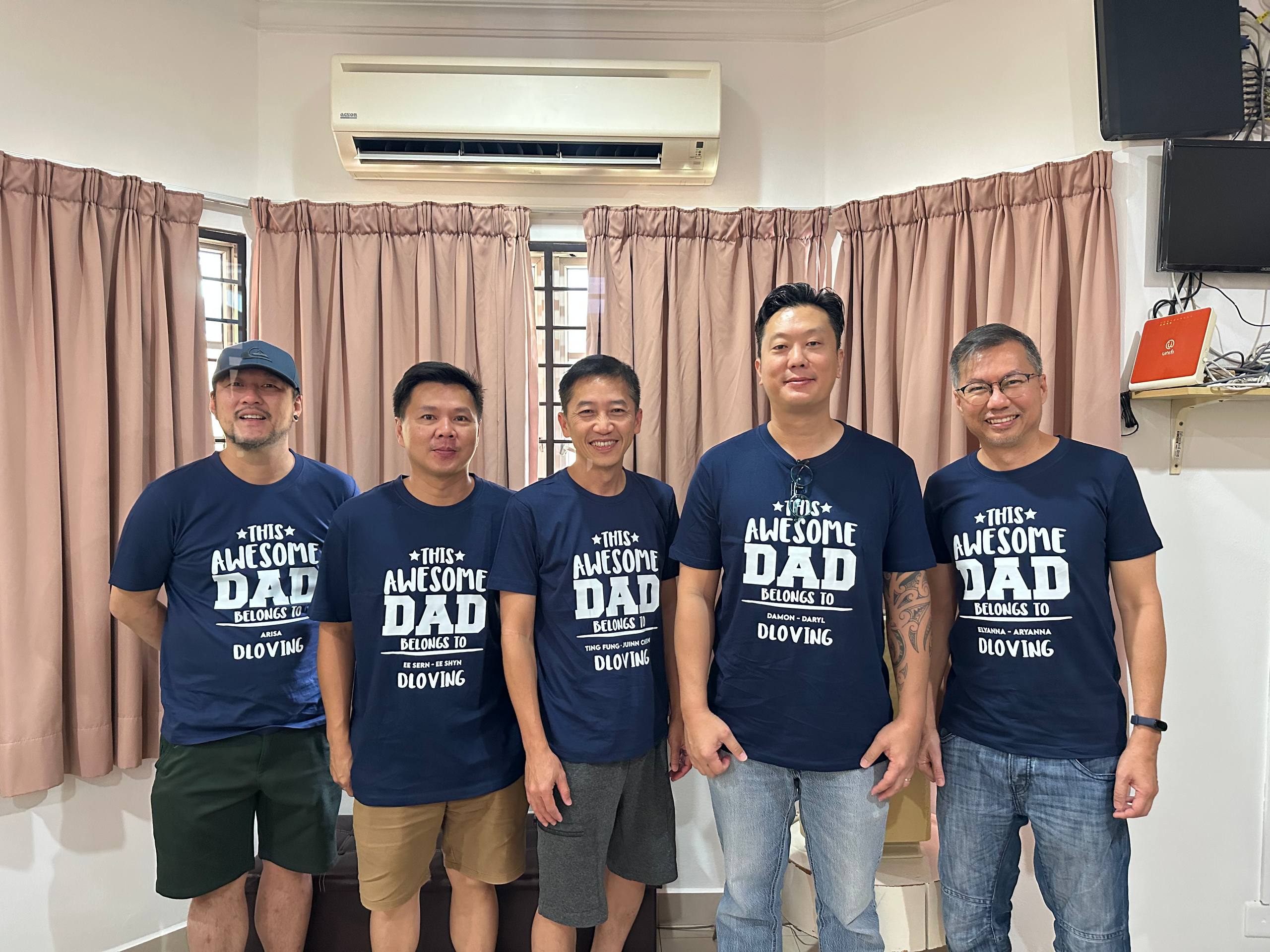 D Loving fathers wearing Super Daddy shirts together